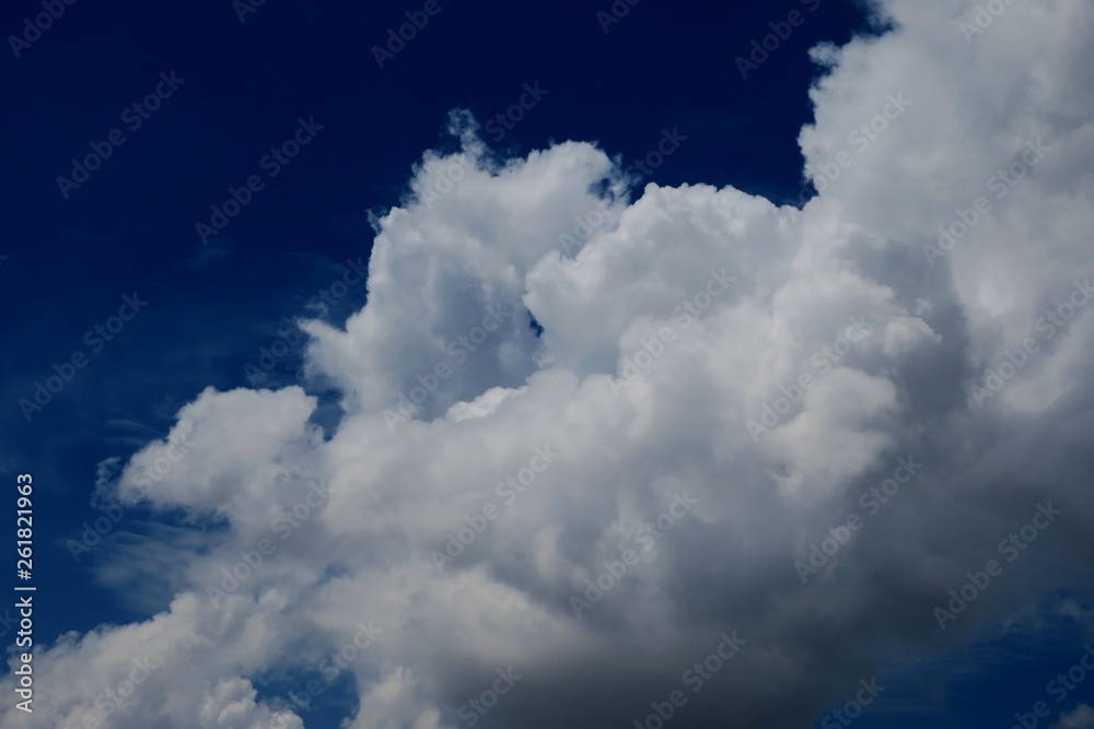 beautiful white fluffy clouds against the blue sky