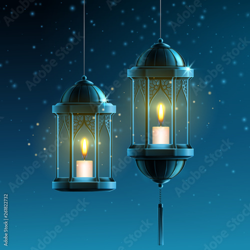 Glowing fanous or vintage fanoos, hanging islam lantern or antique arab light with candle at night. Background symbol or object for ramadan kareem or eid mubarak. Eastern or muslim holiday theme