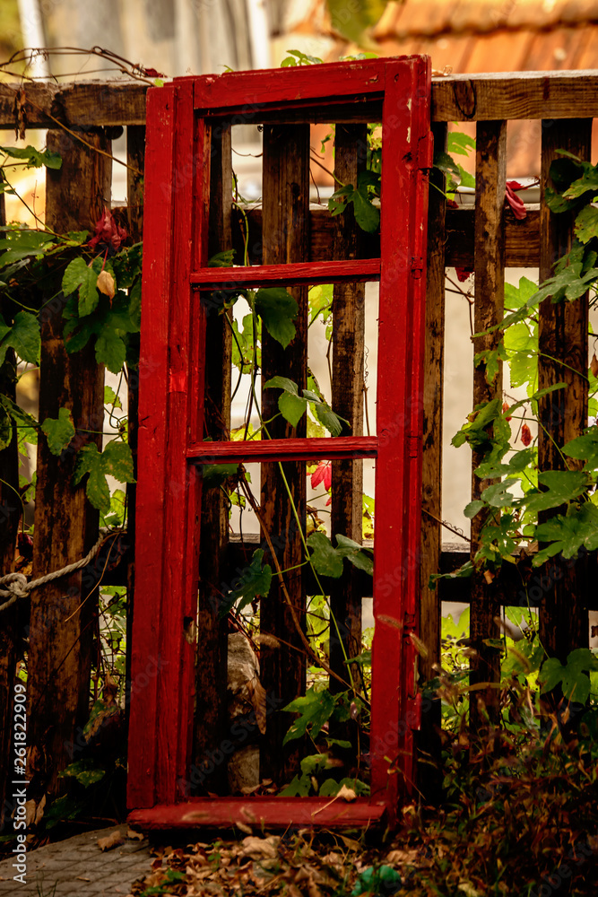 Red window left in the garden