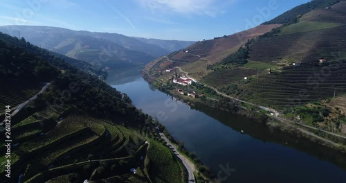 Aerial view of the terraced vineyards in the Douro Valley and river near the village of Pinhao, Portugal; 