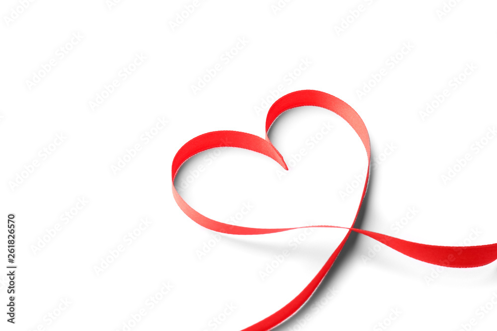 Heart made of red ribbon on white background. Festive decoration