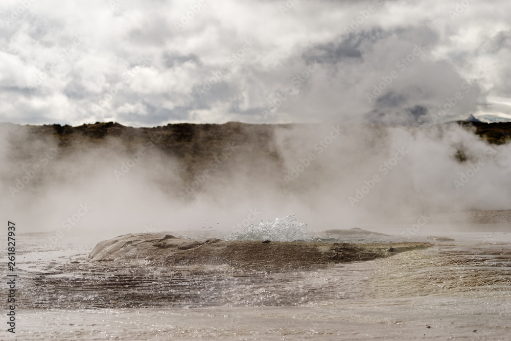 Geothermal area with strong steam outlet, center of a basin where hot water bubbles, mineral deposits - Location: Iceland