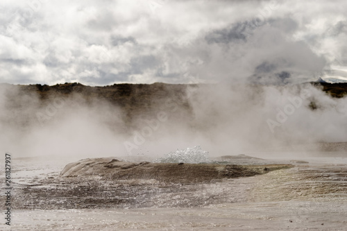 Geothermal area with strong steam outlet, center of a basin where hot water bubbles, mineral deposits - Location: Iceland