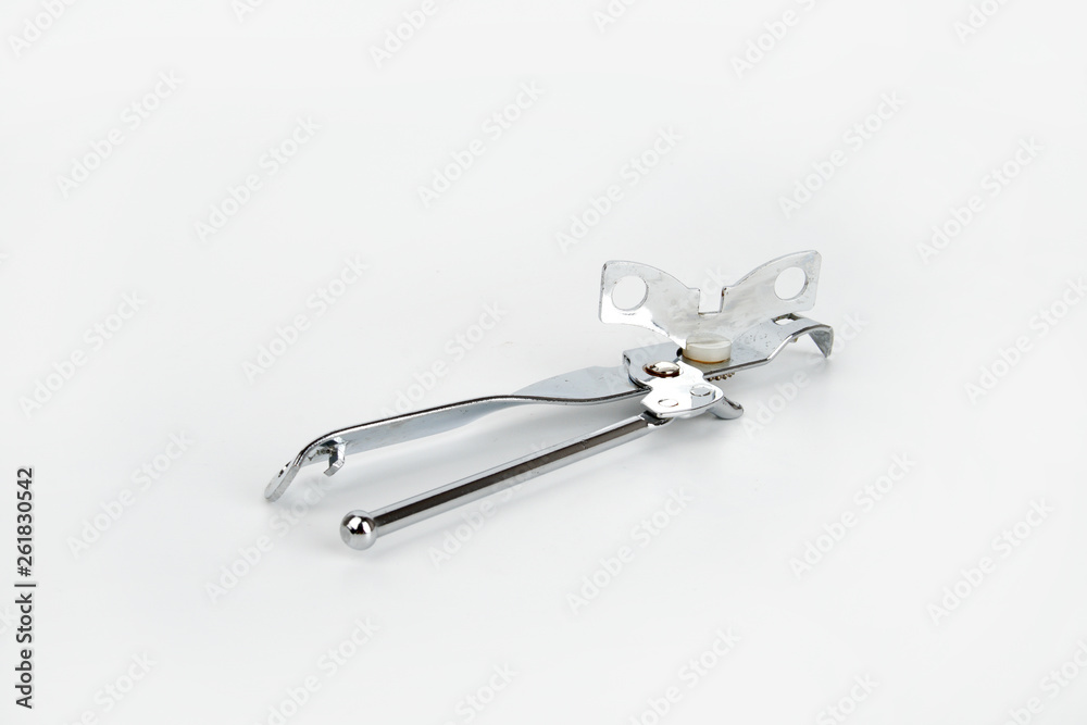 A can opener isolated against a white background A can opener isolated against a white background