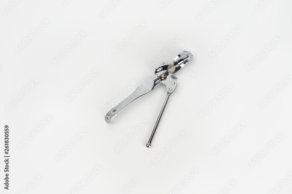 A can opener isolated against a white background A can opener isolated against a white background