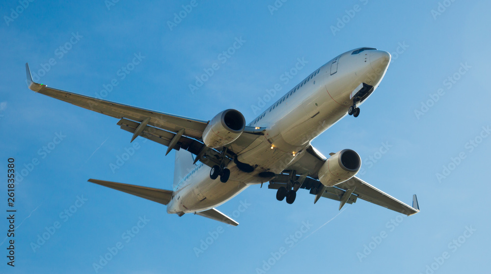 Fototapeta Passenger plane departing in afternoon