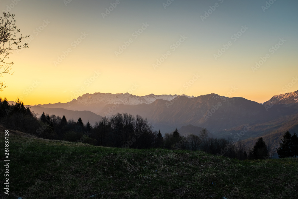 Sunset over Soca valley and mountain Kanin in Julian Alps