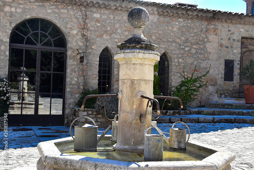fountain with watering pots in provence france