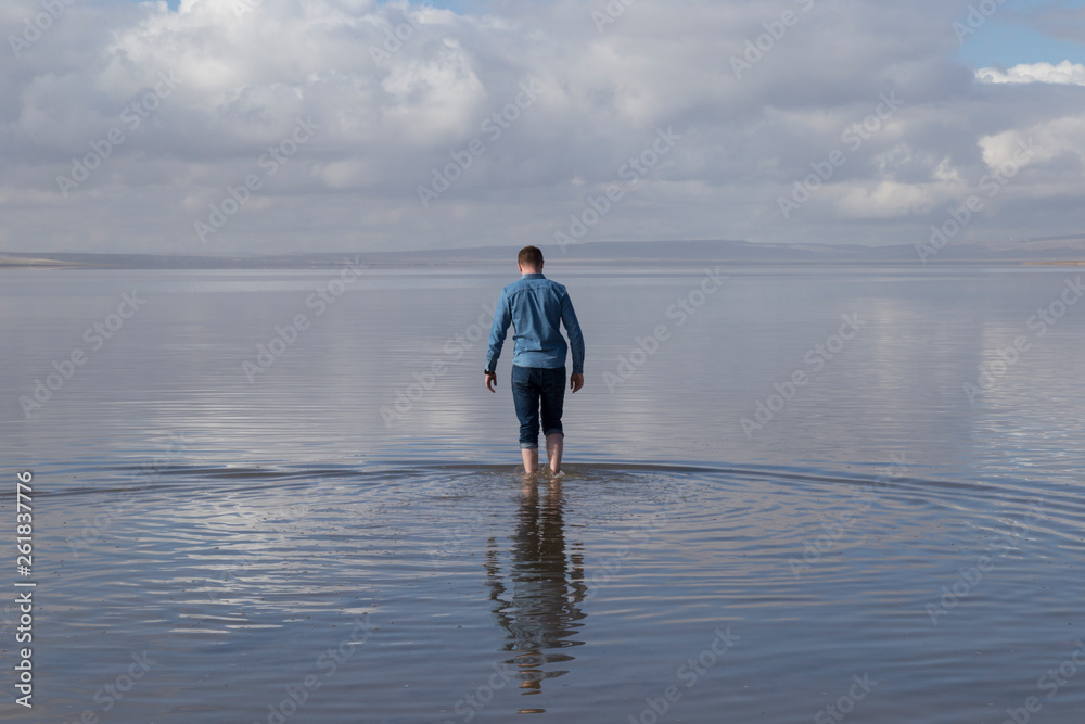 the salt lake from Aksaray , Ankara - Turkey. The people reflection is on the lake.