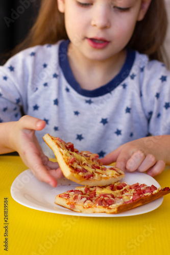 Baby eating pizza