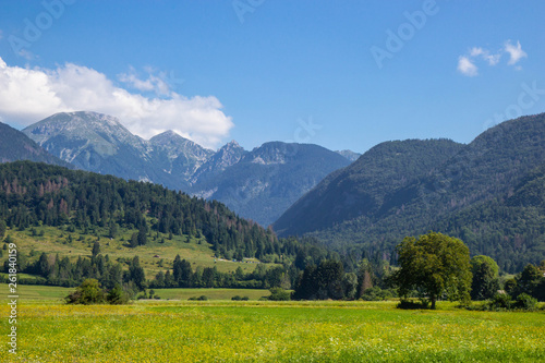 Summer sunny scene of mountains in Triglav National Park in Slovenia © Tomtsya