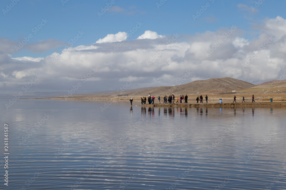the salt lake from Aksaray , Ankara - Turkey. The people reflection is on the lake.