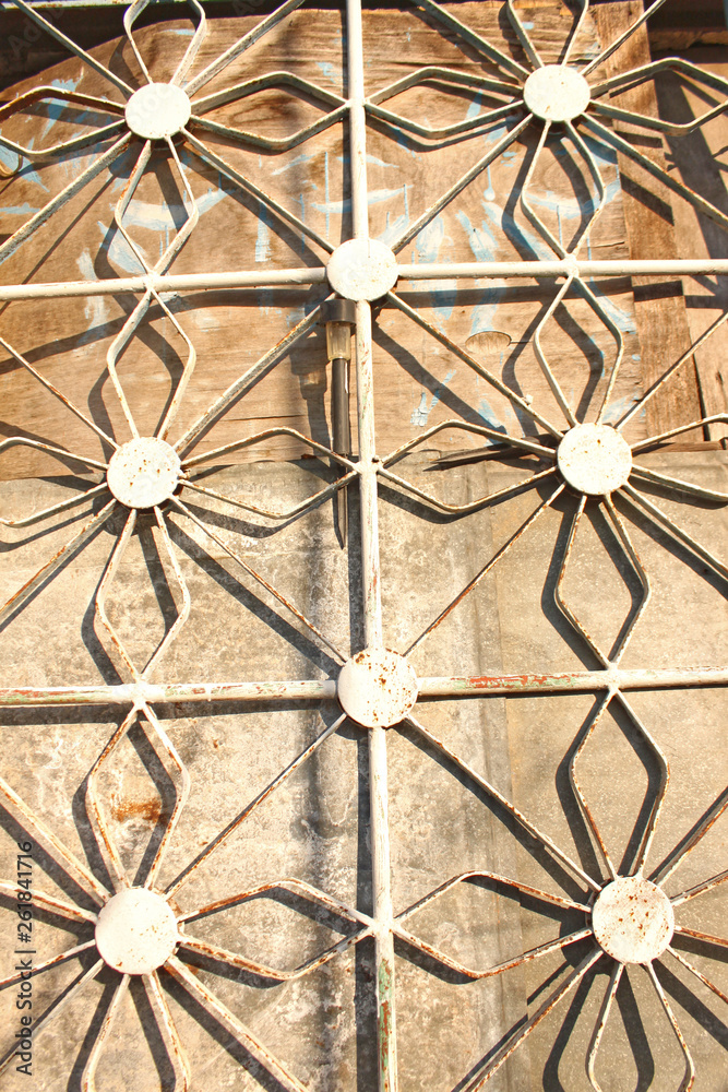Forged metal figured lattices on the windows, unusual shape, solar lantern.