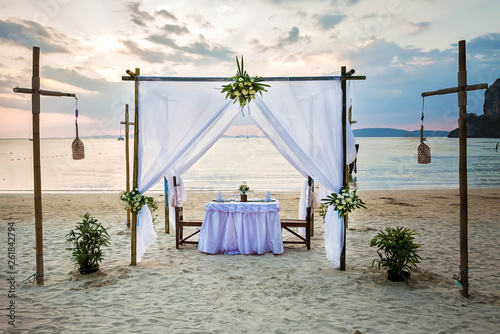 Wallpaper Mural Romantic dinner table on the beach Torontodigital.ca