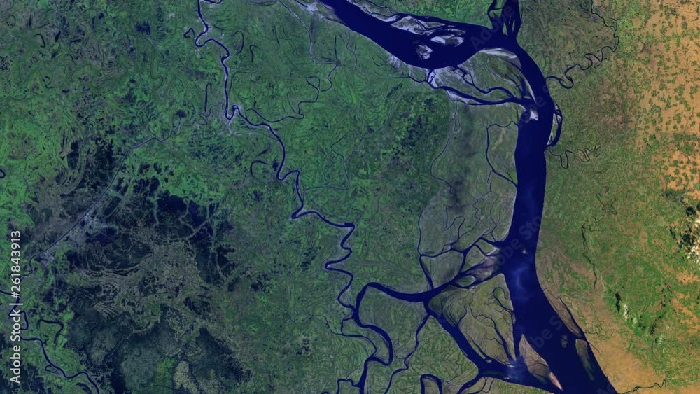Aerial satellite view of riverbed in green land, water resource and transport route, Padma river in Bangladesh sunrise animation. Contains public domain image by Nasa