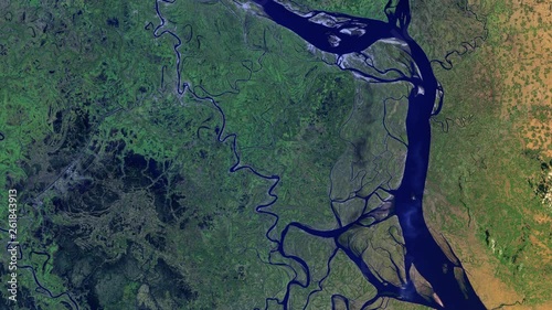 Aerial satellite view of riverbed in green land, water resource and transport route, Padma river in Bangladesh sunrise animation. Contains public domain image by Nasa photo