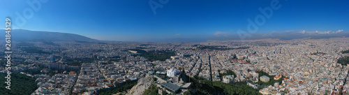 Fototapeta Naklejka Na Ścianę i Meble -  Aerial drone panoramic photo of iconic Saint George Lycabettus chapel as seen from top of hill, all Athens cityscape and Acropolis hill at the background, Athens historic centre, Attica, Greece