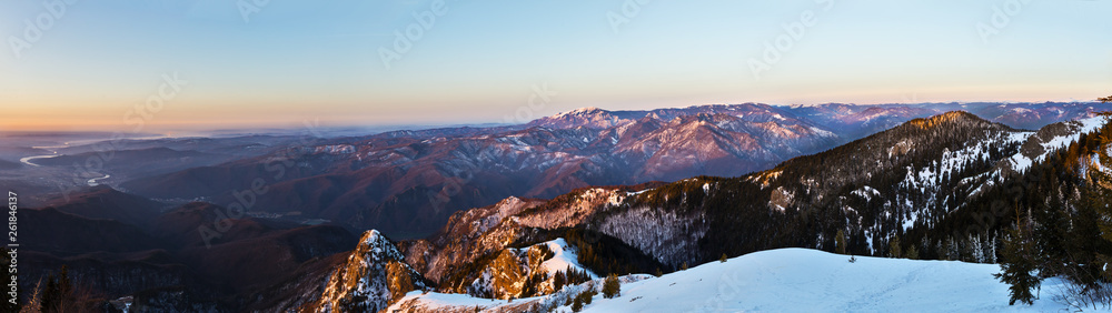 Winter panorama from Cozia peak on Olt river and Builla Vnaturarita mountains
