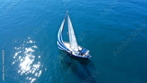 Aerial drone birds eye view of sail boat cruising in the deep blue Aegean sea, Greece © aerial-drone