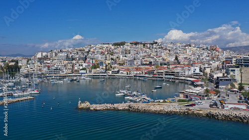 Aerial drone bird's eye view panoramic photo of iconic round shaped picturesque port of Mikrolimano with sail boats and yachts docked and beautiful clouds, Piraeus port, Attica, Greece