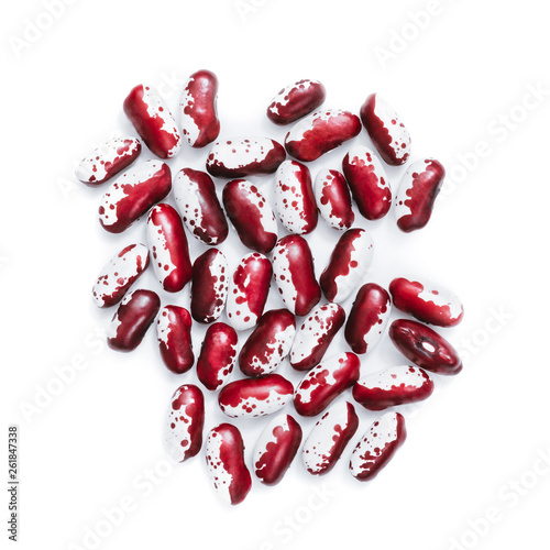Pile of ripe speckled kidney Anasazi beans, with vivid burgundy color isolated on white background. Close-up.