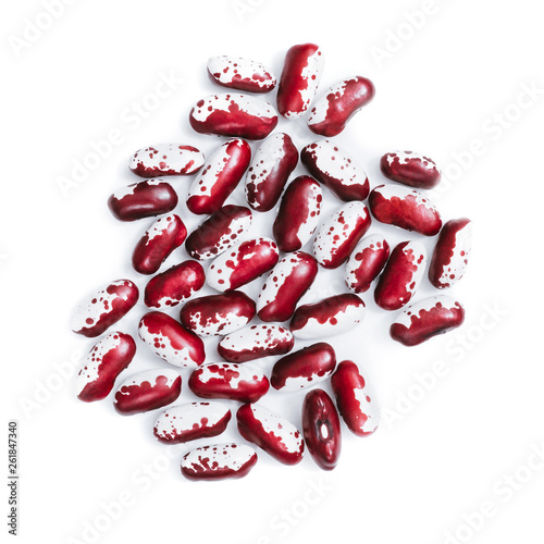 Pile of ripe speckled kidney Anasazi beans, with vivid burgundy color isolated on white background. Close-up.