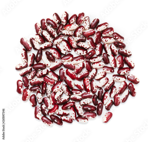 Pile of ripe speckled kidney Anasazi beans, with vivid burgundy color isolated on white background. Close-up.