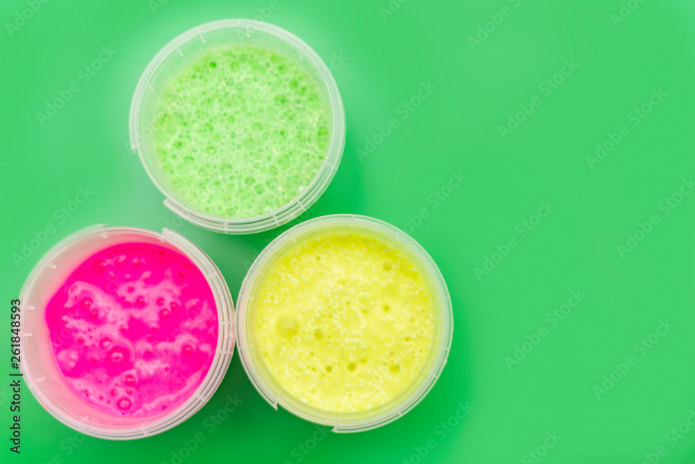 colorful slimes on green background colorful slimes on green background