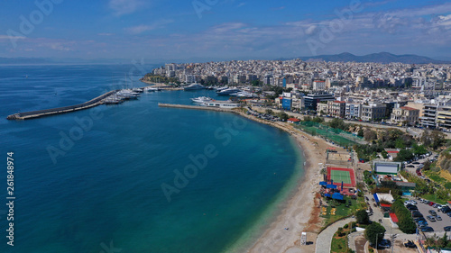 Fototapeta Naklejka Na Ścianę i Meble -  Aerial drone panoramic photo of iconic port of Marina Zeas or Pasalimani with yachts and sail boats docked and beautiful blue sky - clouds, port of Piraeus, Attica, Greece