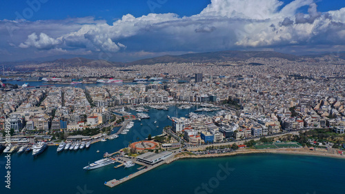 Aerial drone panoramic photo of iconic port of Marina Zeas or Pasalimani with yachts and sail boats docked and beautiful blue sky - clouds  port of Piraeus  Attica  Greece