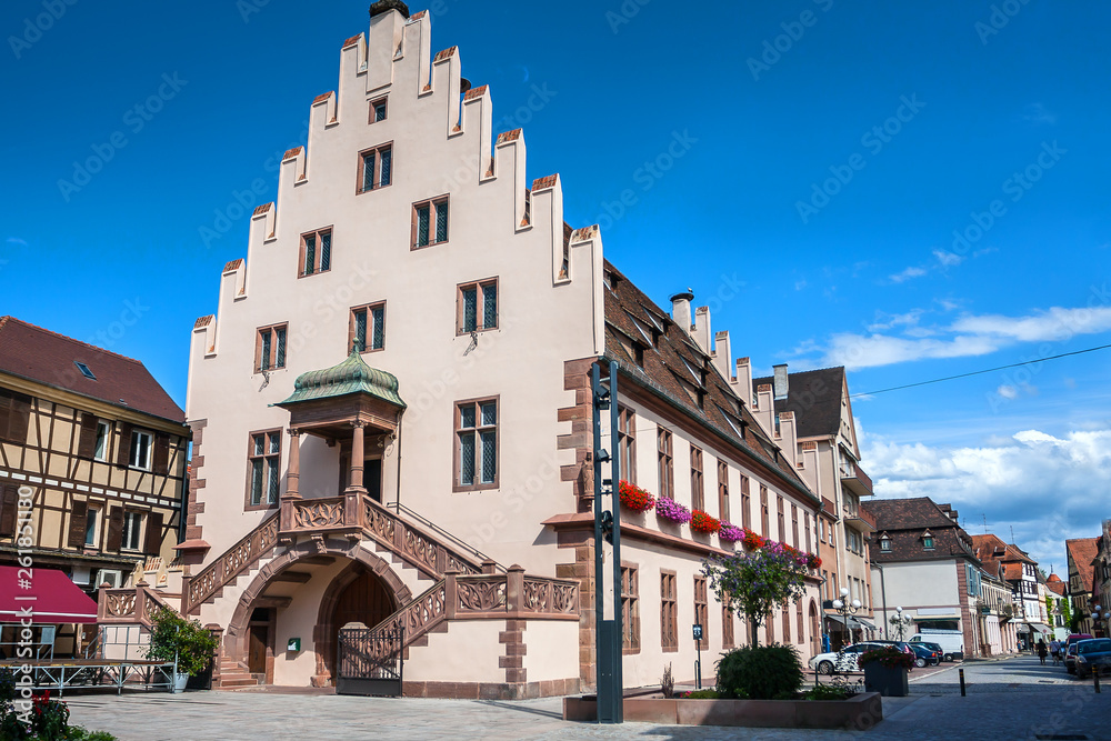 Naklejka premium Beautiful half-timbered houses with red tiled roofs in the historic center of Selestat in Alsace.