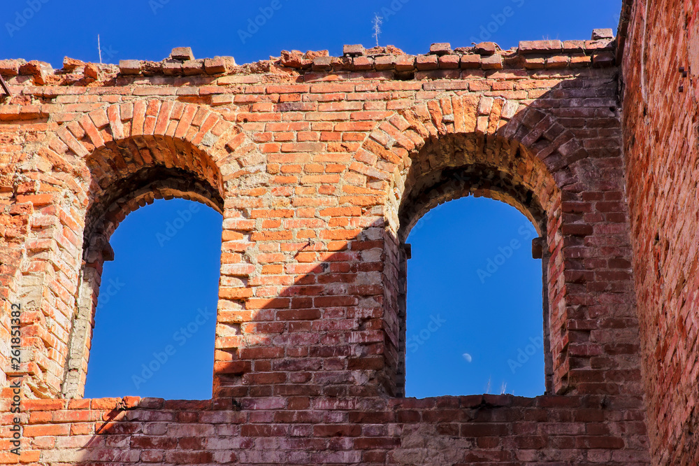 The ruins of an old brick building of red brick.
