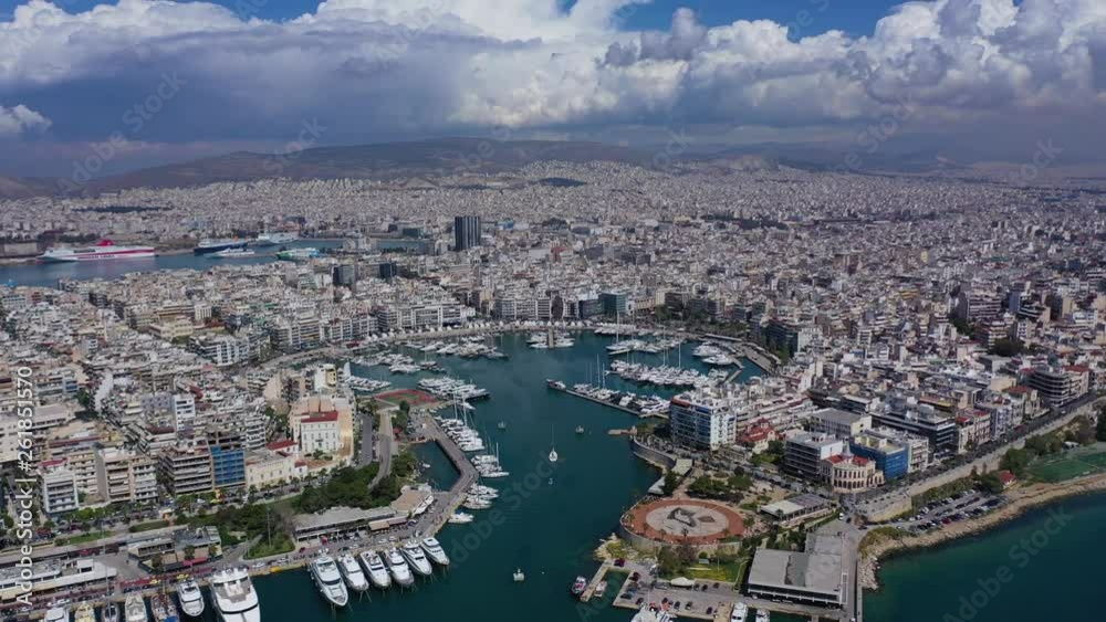 Aerial drone panoramic video of iconic port of Marina Zeas or Pasalimani with yachts and sail boats docked and beautiful blue sky - clouds, port of Piraeus, Attica, Greece Aerial drone panoramic video of iconic port of Marina Zeas or Pasalimani with yachts and sail boats docked and beautiful blue sky - clouds, port of Piraeus, Attica, Greece