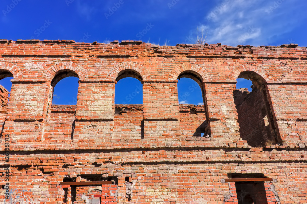 The ruins of an old brick building of red brick.