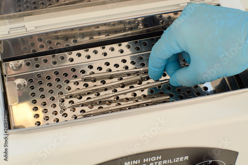 Mini high temperature sterelizer. Medical equipment healthcare. Modern medical technology concept. Modern hospital. Close-up sterilizer for manicure tools.