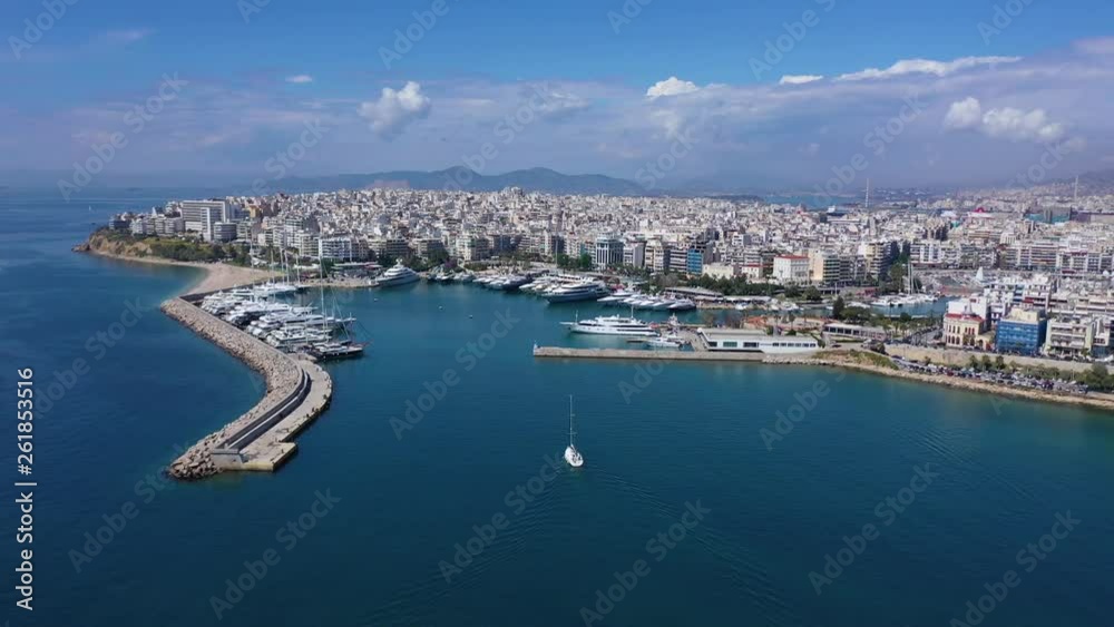 Aerial drone panoramic video of iconic port of Marina Zeas or Pasalimani with yachts and sail boats docked and beautiful blue sky - clouds, port of Piraeus, Attica, Greece Aerial drone panoramic video of iconic port of Marina Zeas or Pasalimani with yachts and sail boats docked and beautiful blue sky - clouds, port of Piraeus, Attica, Greece