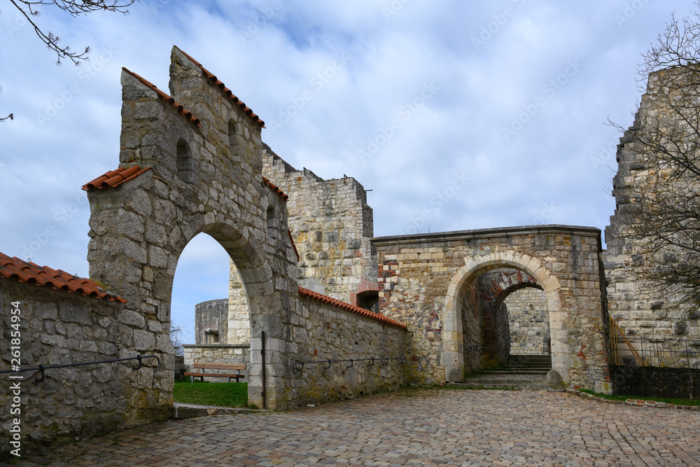 arches in the castle ruin Hellenstein on the hill of Heidenheim an der Brenz in southern Germany against a blue sky with clouds, copy space
