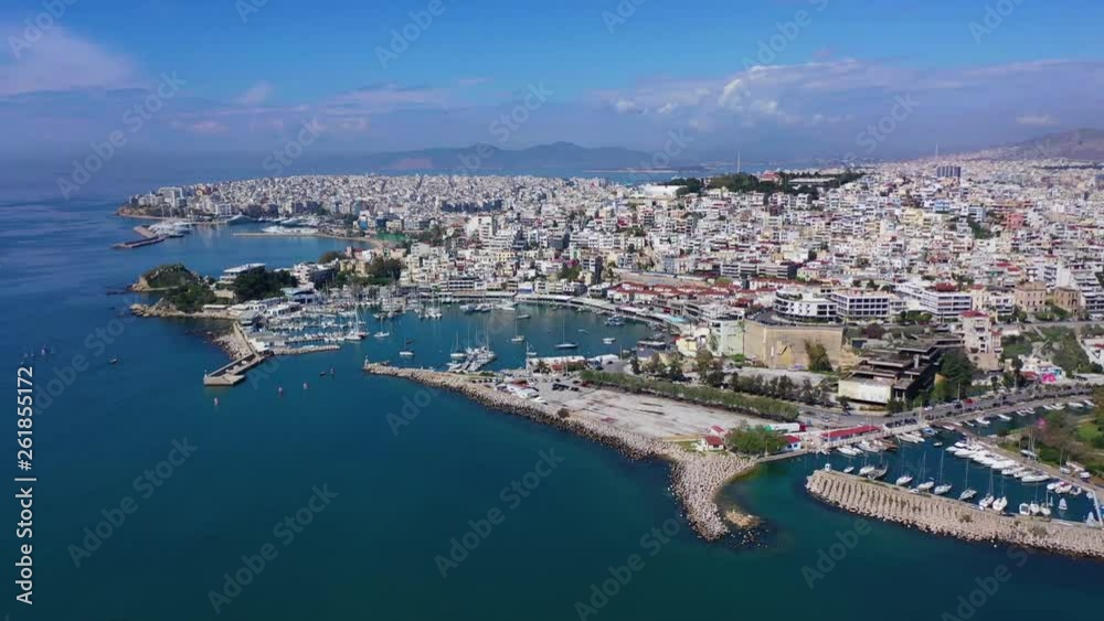 Aerial drone panoramic video of iconic port of Marina Zeas or Pasalimani with yachts and sail boats docked and beautiful blue sky - clouds, port of Piraeus, Attica, Greece Aerial drone panoramic video of iconic port of Marina Zeas or Pasalimani with yachts and sail boats docked and beautiful blue sky - clouds, port of Piraeus, Attica, Greece
