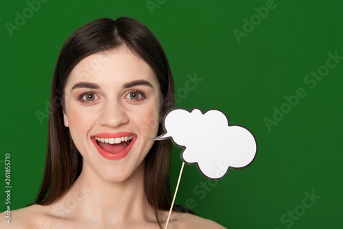 Happy smiling girl with paper sample of ideas photo