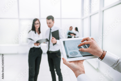 close up. digital tablet in the hands of a businessman.