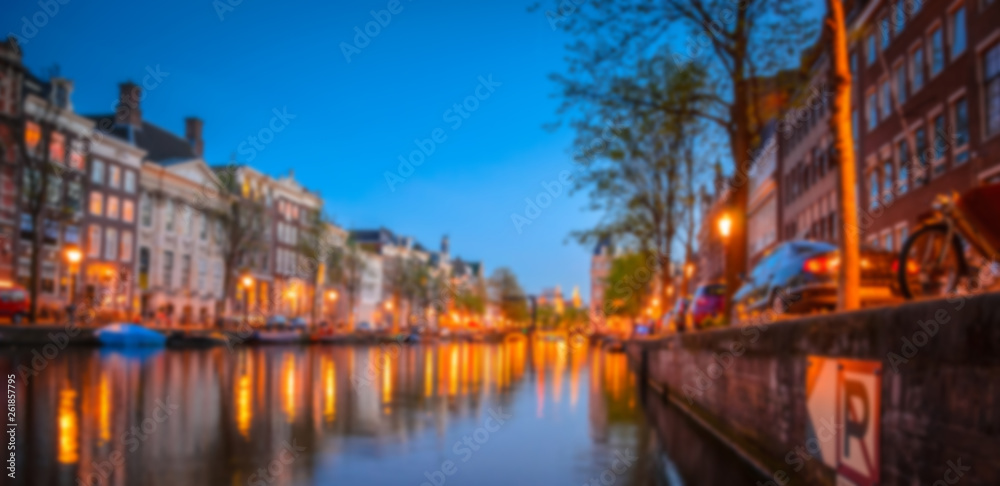 Blurred night panorama of Amsterdam, Netherlands.