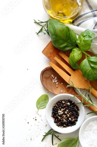 Wooden spoon, fork and ingredients on white background. Vegetarian and vegan food. Healthy cooking concept. Top view with copy space.
