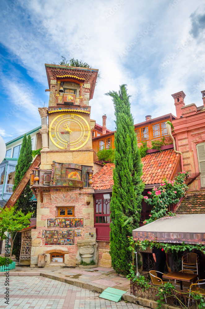 Fototapeta premium Beautiful Clock Tower of puppet theater Rezo Gabriadze in historical center of old Tbilisi, Georgia