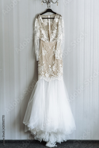Wedding Dress. Luxurious white bridal dress weighs in the room