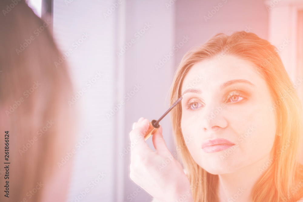 Process of making makeup artist working with brush on model face, beauty and fashion concept Process of making makeup artist working with brush on model face, beauty and fashion concept