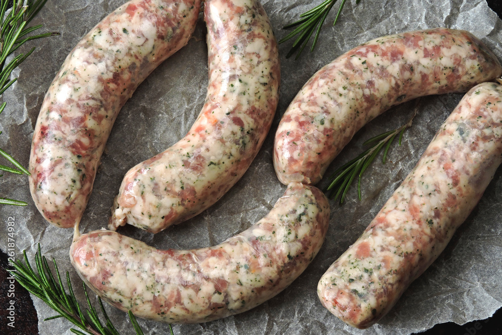 Raw sausages for grill or barbecue. Juicy Bavarian sausages uncooked. Raw sausages for grill or barbecue. Juicy Bavarian sausages uncooked.