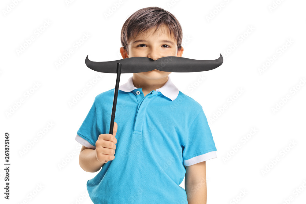Funny little boy holding moustache on a stick on his face Funny little boy holding moustache on a stick on his face