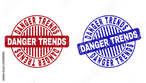 Grunge DANGER TRENDS round stamp seals isolated on a white background. Round seals with grunge texture in red and blue colors.