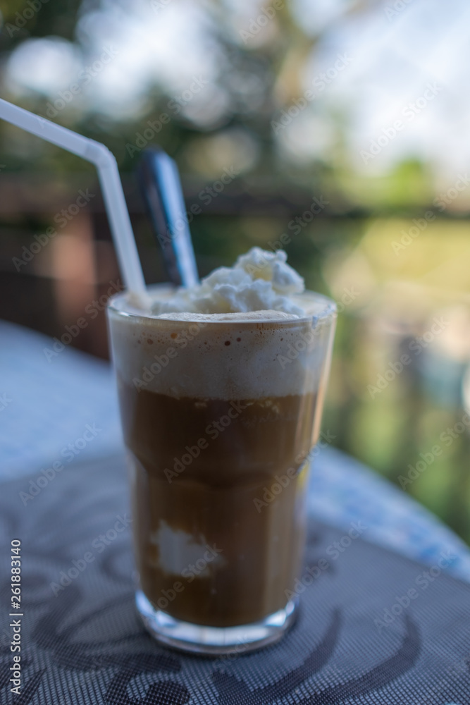 cup of coconut coffee with on wooden background cup of coconut coffee with on wooden background