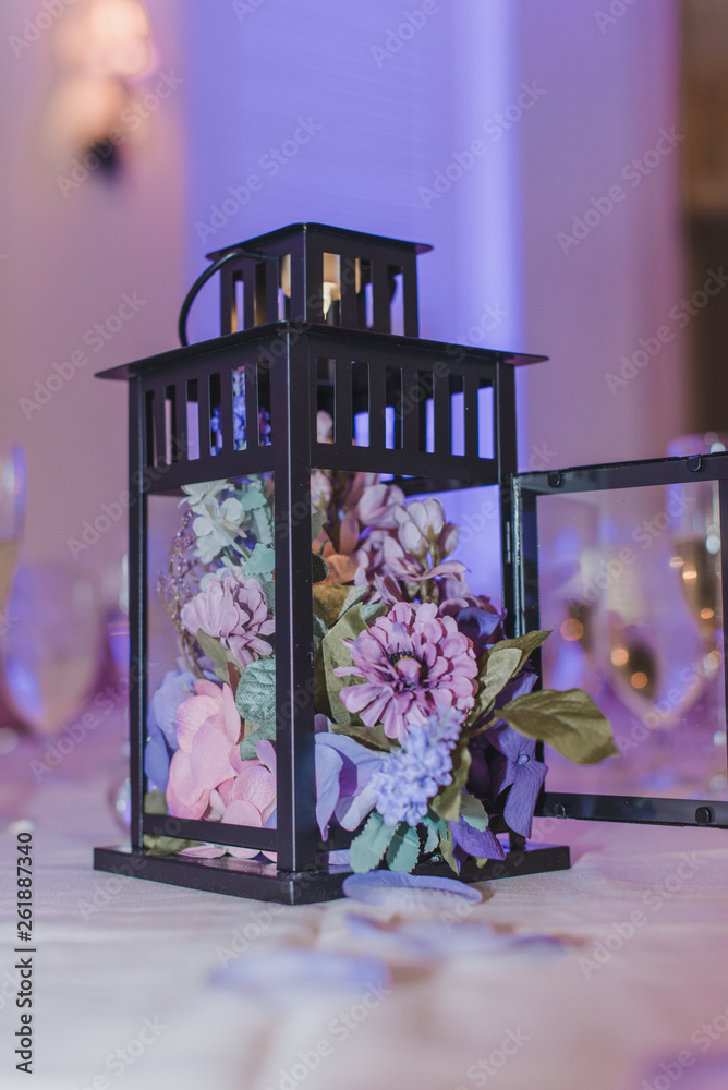 Black candle lantern decor at wedding reception